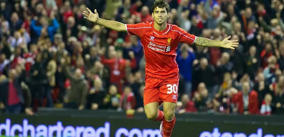 Player celebrating goal with fans at Anfield