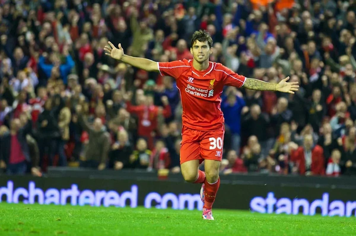 Player celebrating goal with fans at Anfield
