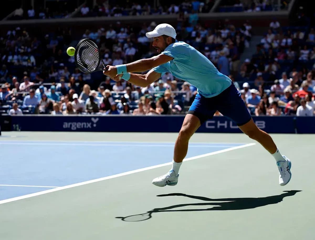 Player lunging to hit a tennis ball during match
