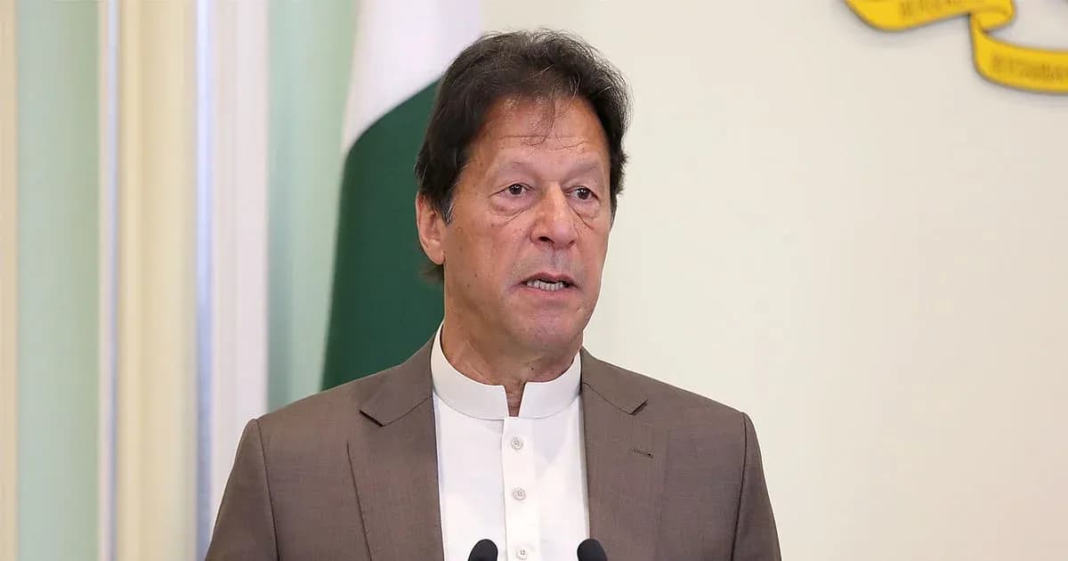 Man speaking at a podium with a flag in background
