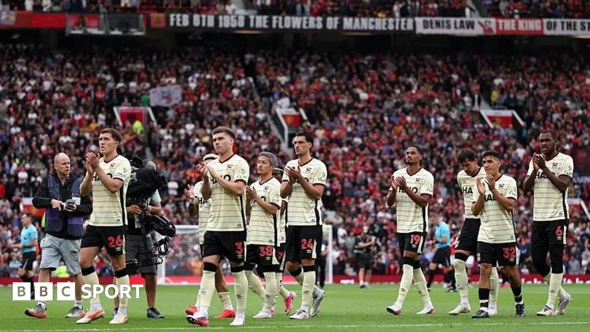Players applauding fans after the match at Old Trafford