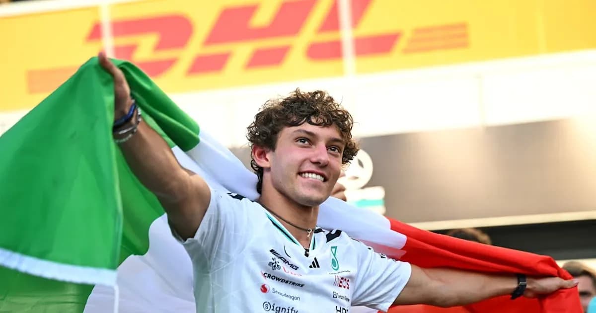 Driver celebrating with Italian flag after race