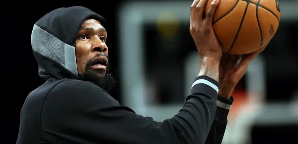Player shooting basketball during practice session