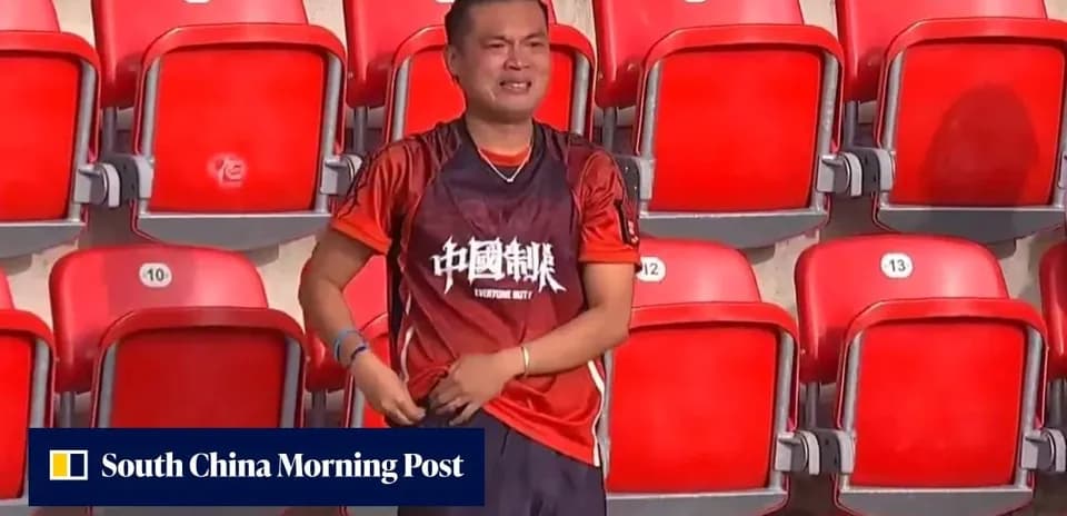 Fan wearing a jersey in empty stadium seats