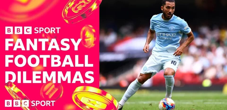 Player dribbling during football match with BBC branding