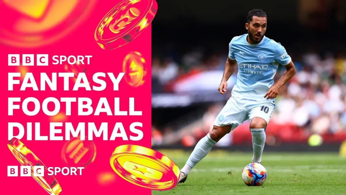 Player dribbling during football match with BBC branding