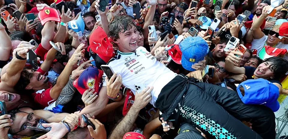 Driver celebrated by fans after race victory