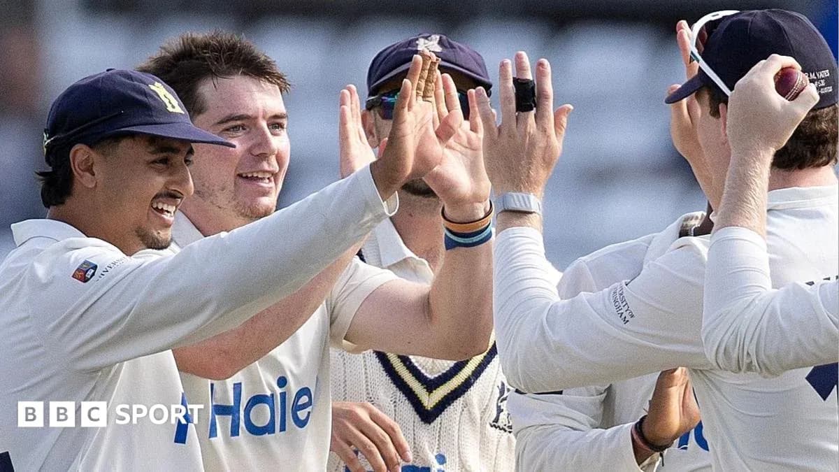 Cricket team celebrating a wicket on the field