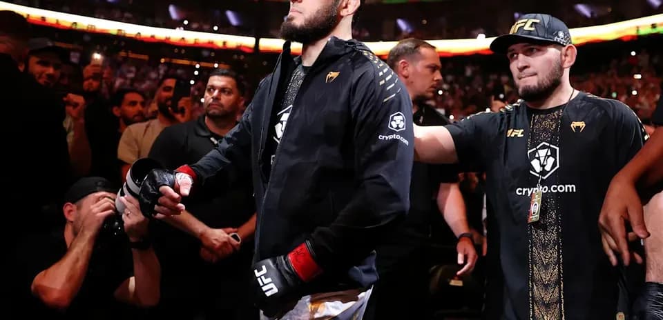 Fighter entering the arena with team members