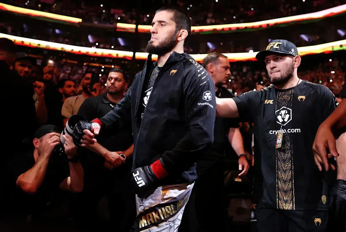 Fighter entering the arena with team members