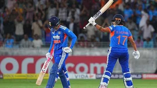 Indian cricket players celebrating after scoring runs