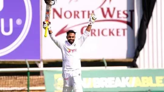 Batsman celebrating after scoring a century