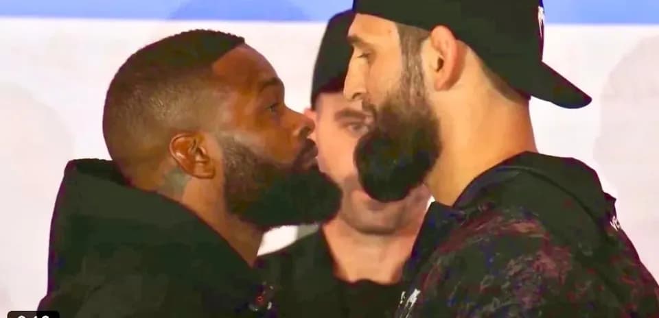 Two fighters facing off during pre-fight event