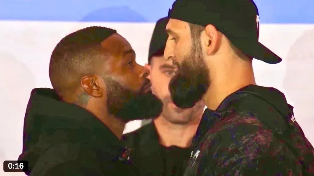 Two fighters facing off during pre-fight event