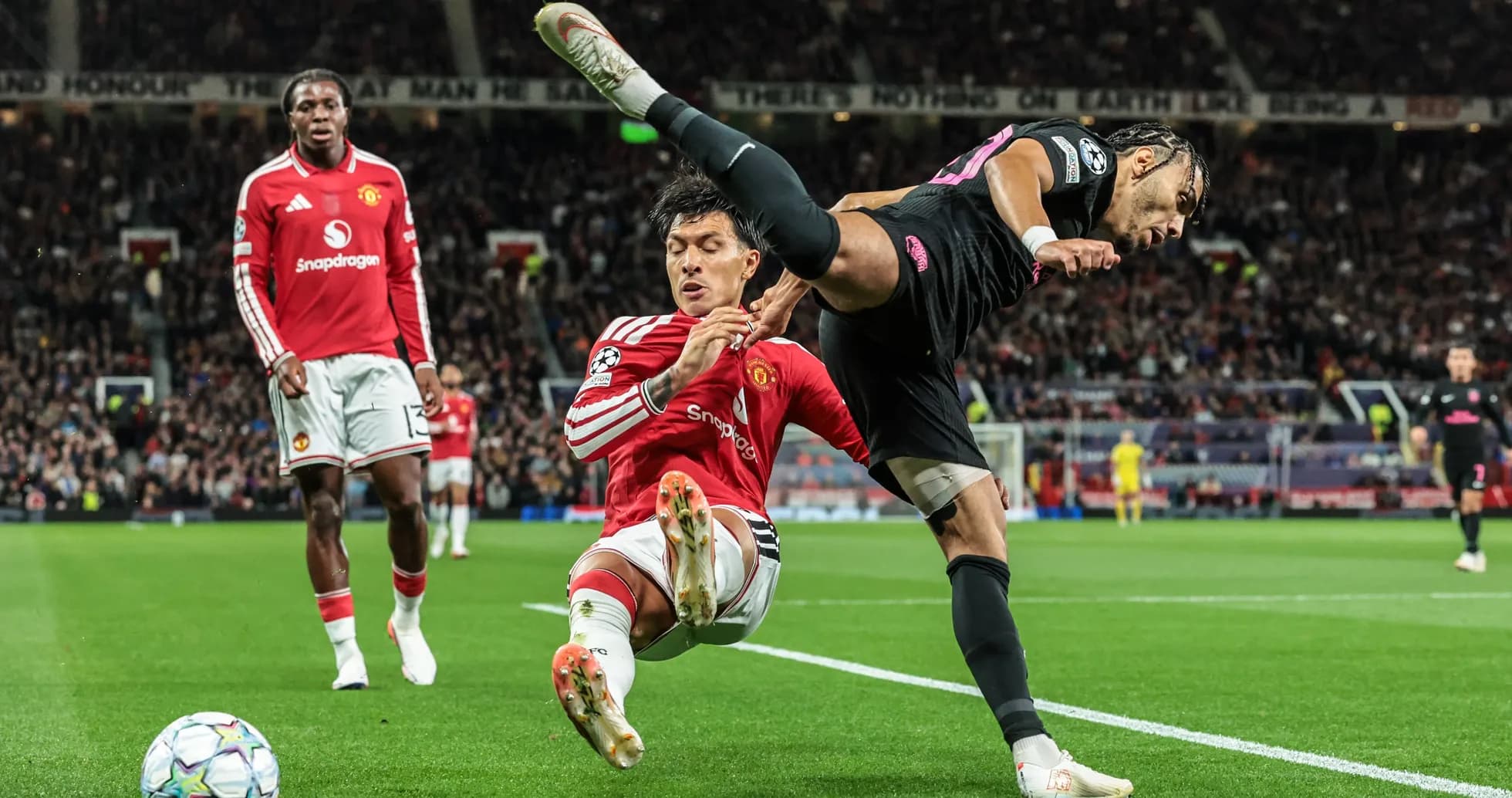 Player tackling opponent near the sideline during match