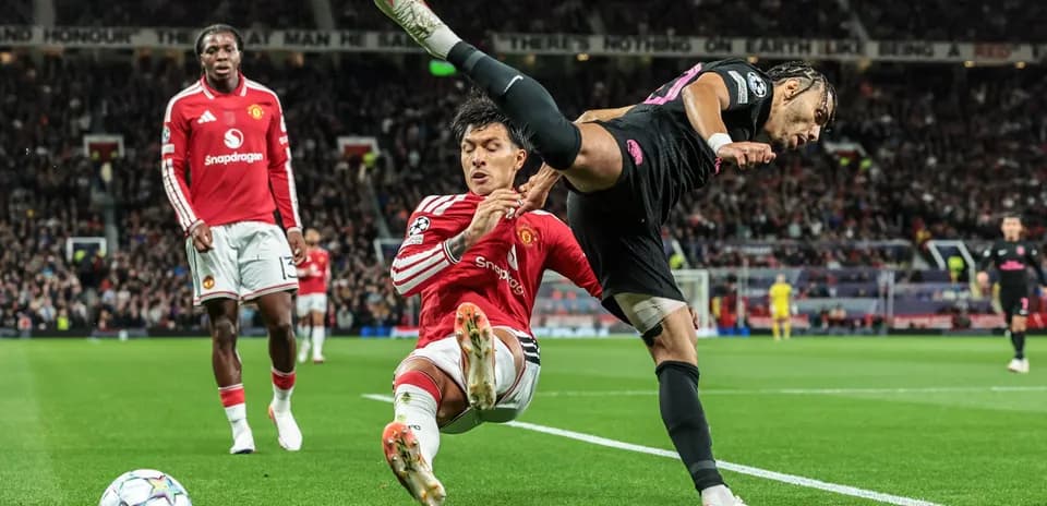 Player tackling opponent near the sideline during match