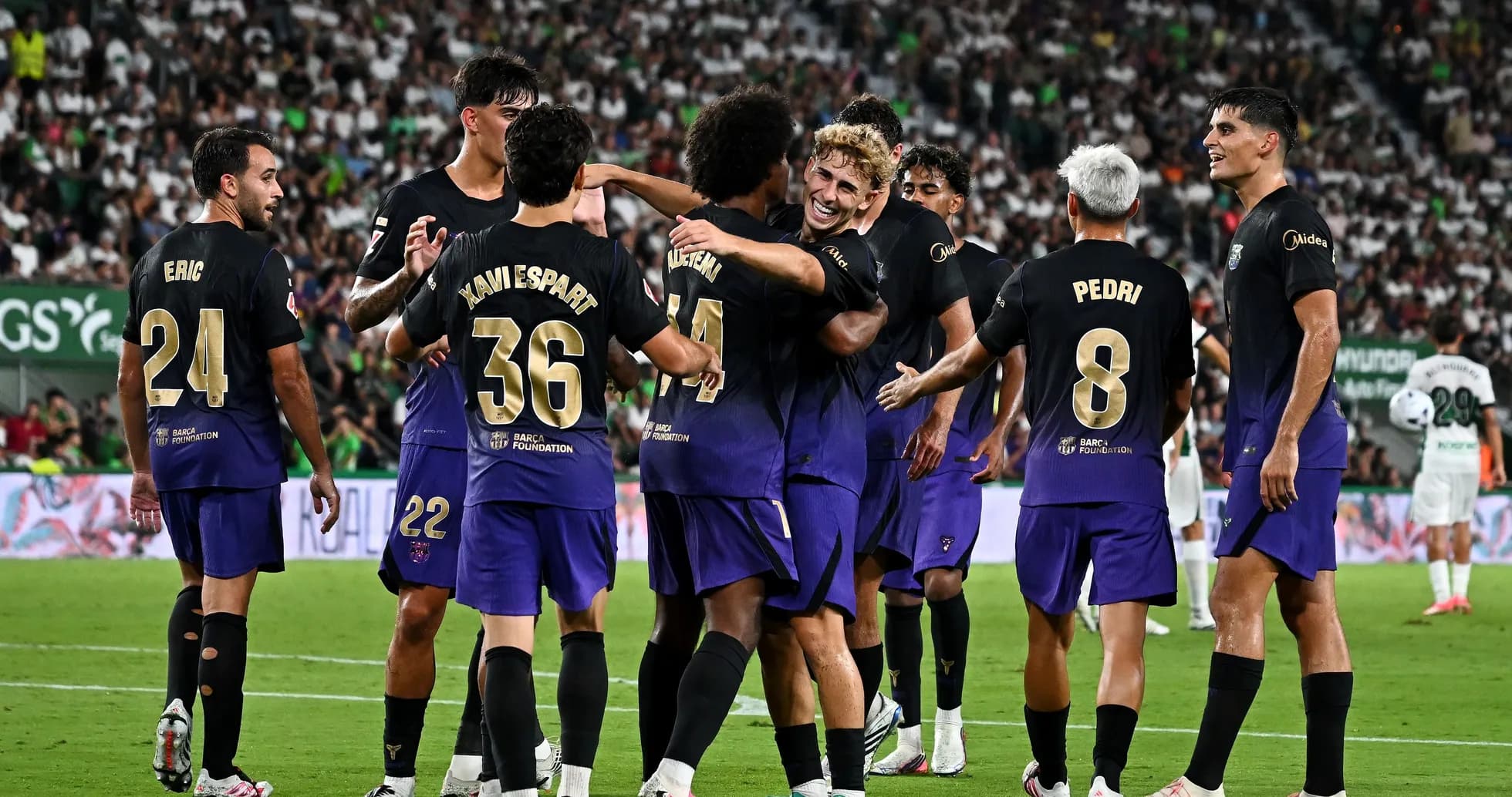 Players celebrating a goal during a match