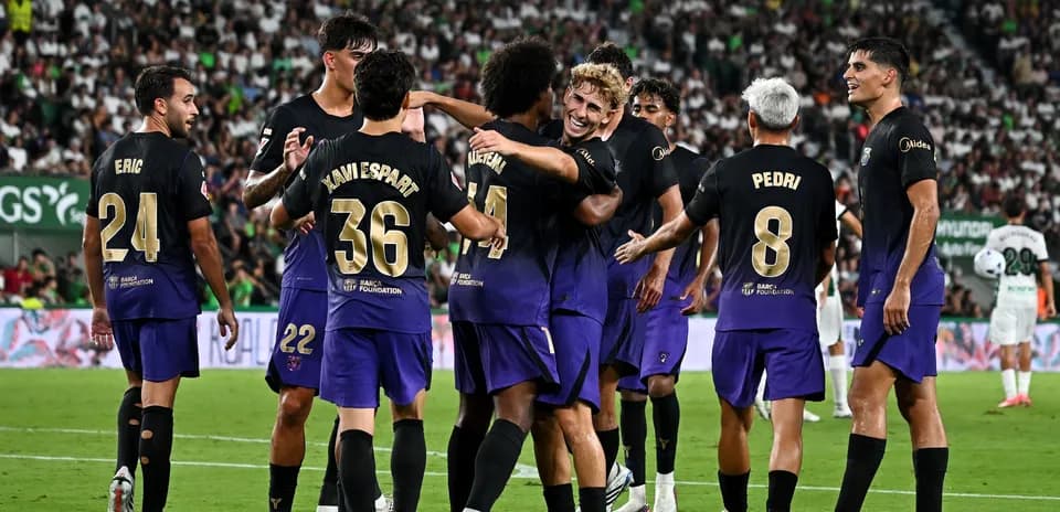 Players celebrating a goal during a match