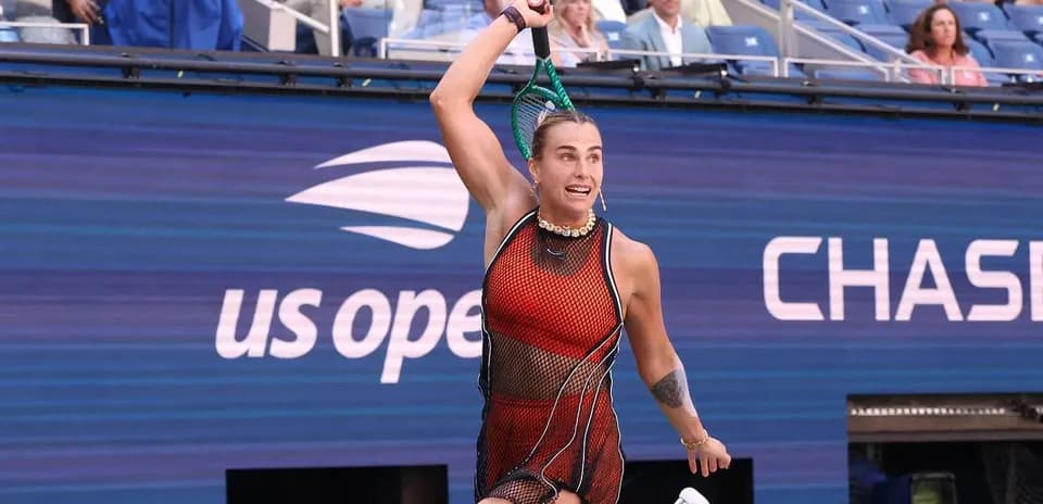 Tennis player serving during US Open match