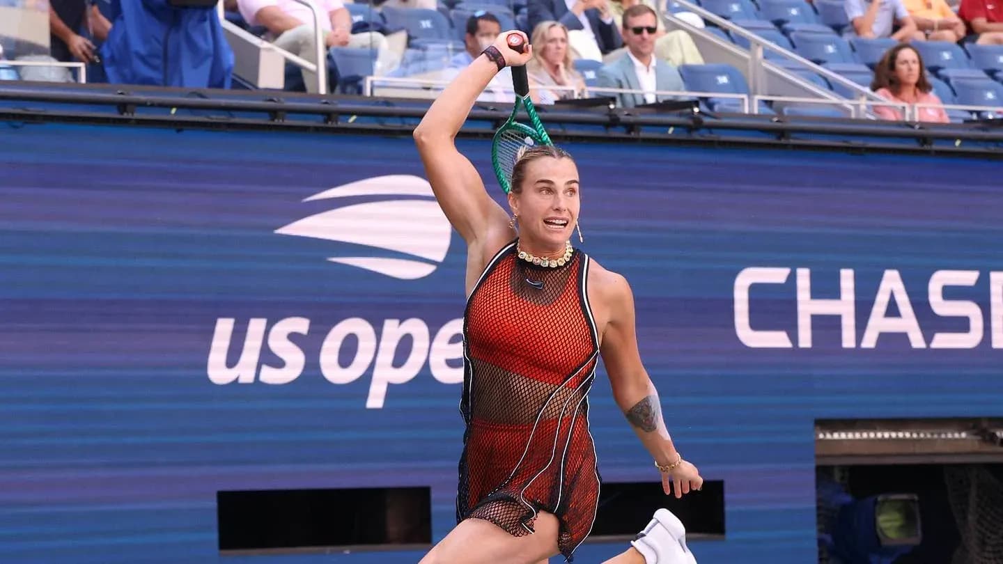 Tennis player serving during US Open match