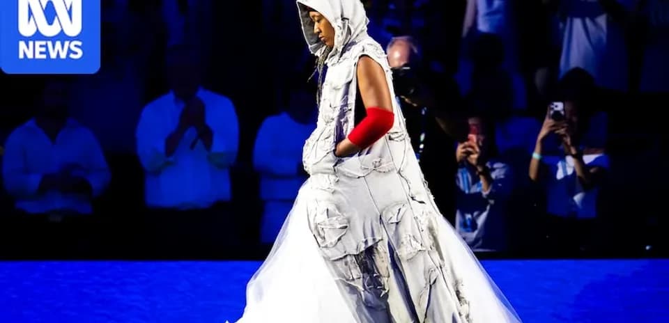 Person in unique attire walking on stage