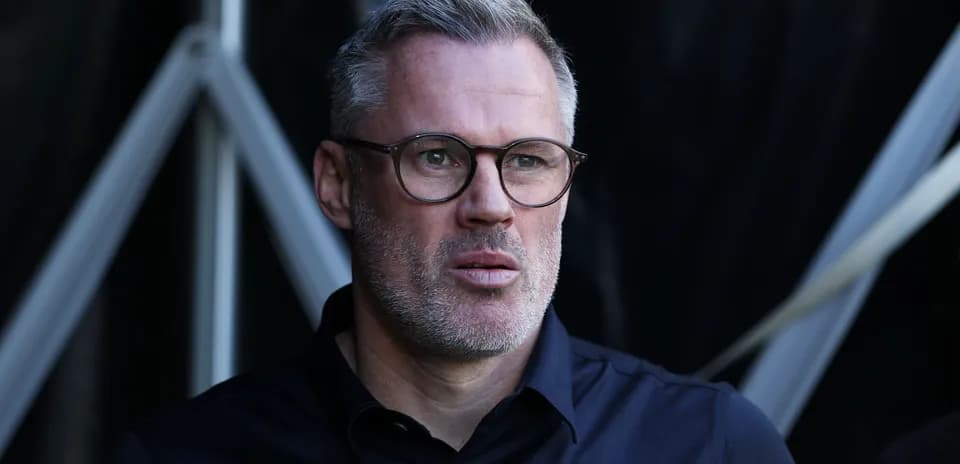 Man with glasses looking thoughtfully during event