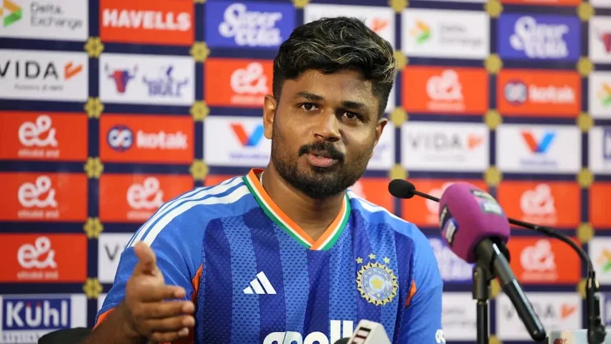 Player speaking at press conference with microphone