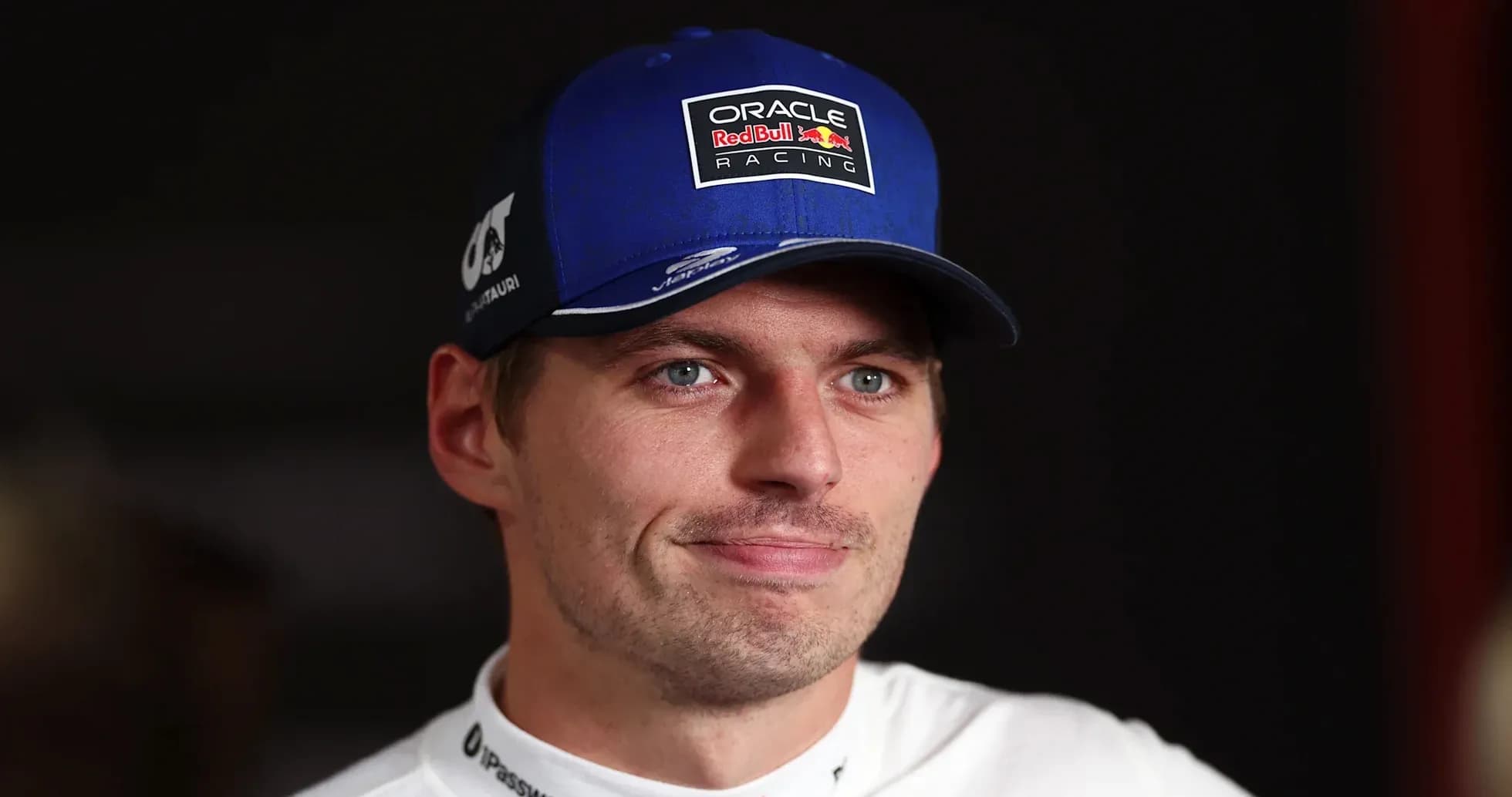 Racing driver wearing cap during interview session