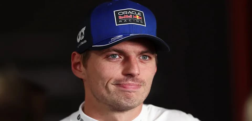 Racing driver wearing cap during interview session