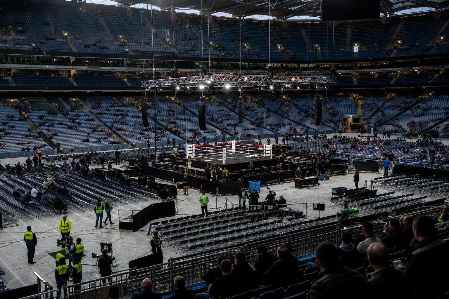 Boxing ring set up in large empty stadium