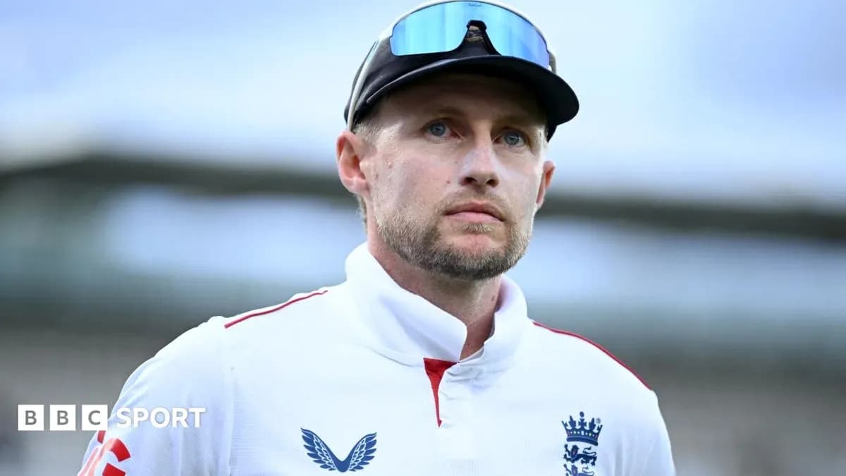 Cricketer in England team jersey looking thoughtfully