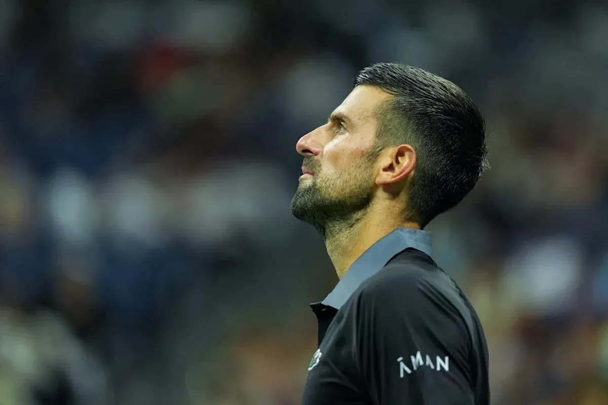 Tennis player looking up during match