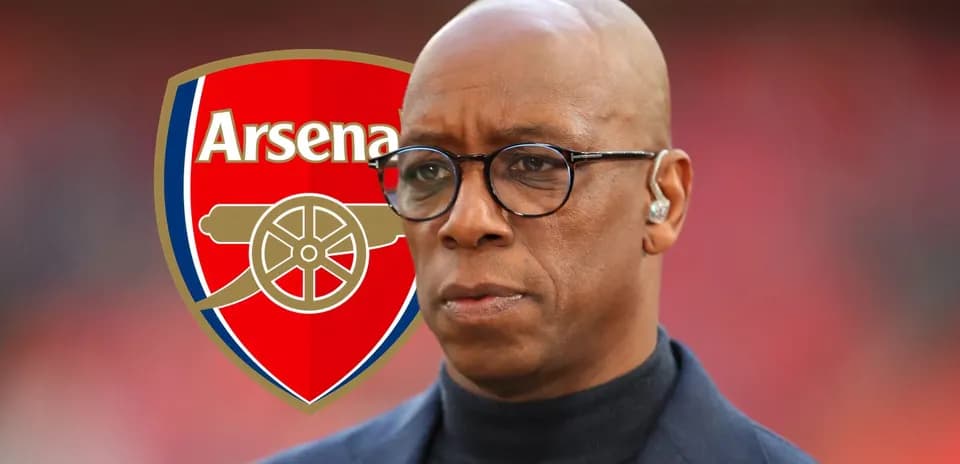 Man in glasses with Arsenal logo background