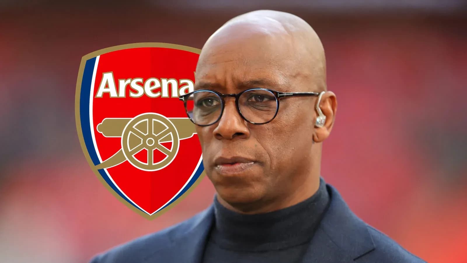 Man in glasses with Arsenal logo background