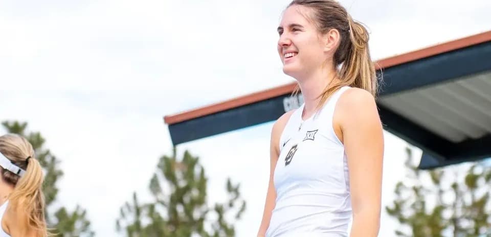 Tennis player smiling during outdoor event