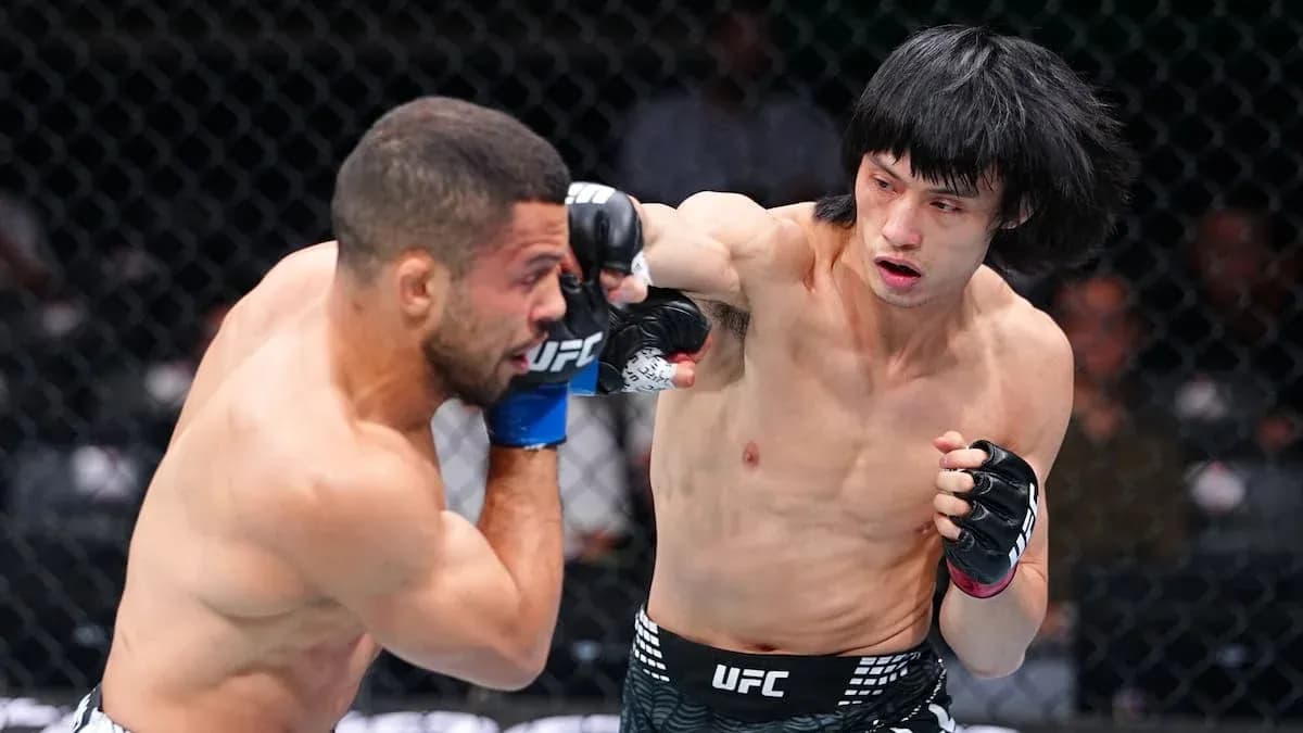 Fighter delivering a punch in UFC match
