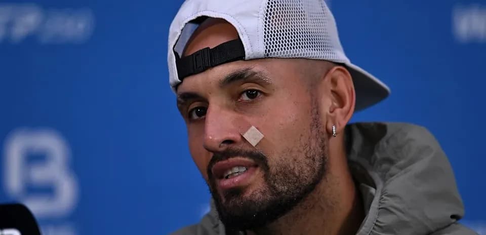Athlete with bandage speaking at press conference