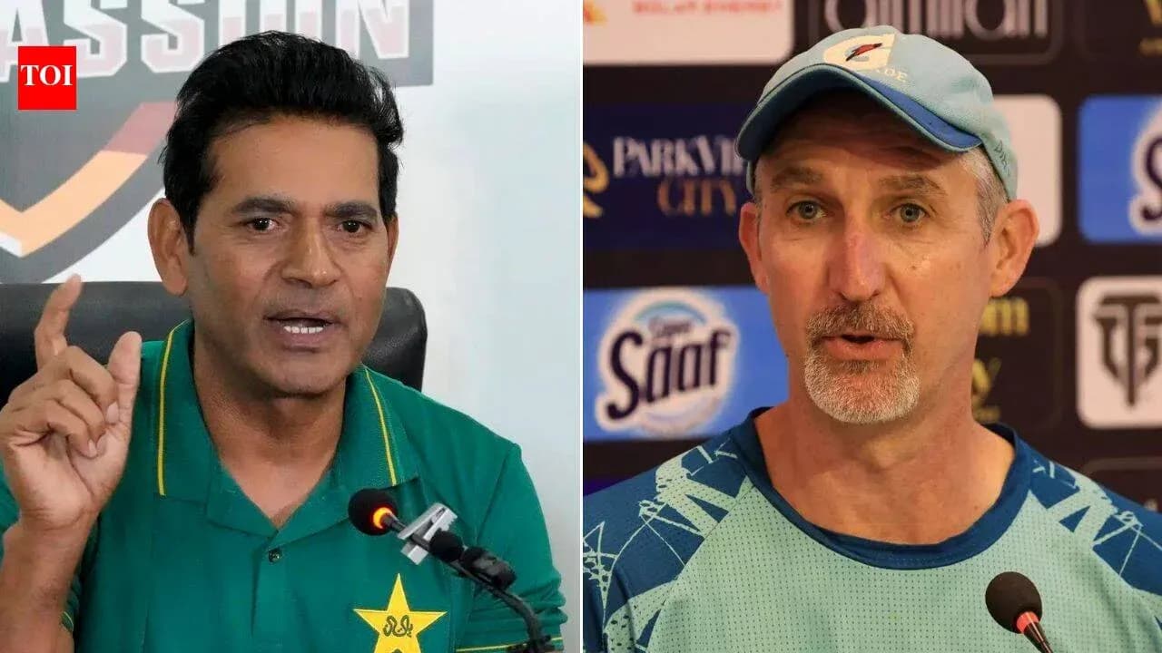 Two cricket coaches speaking at press conference