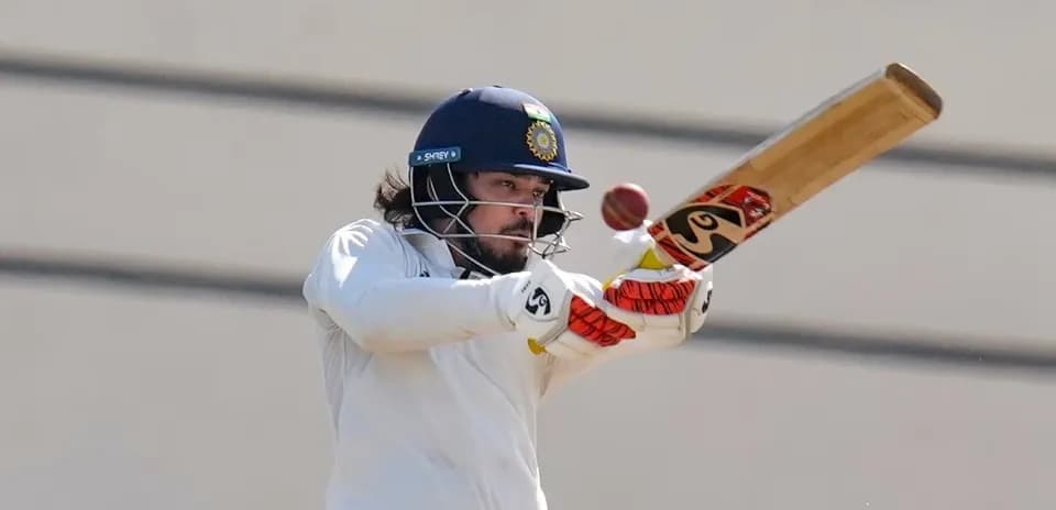 Batsman striking the ball during cricket match