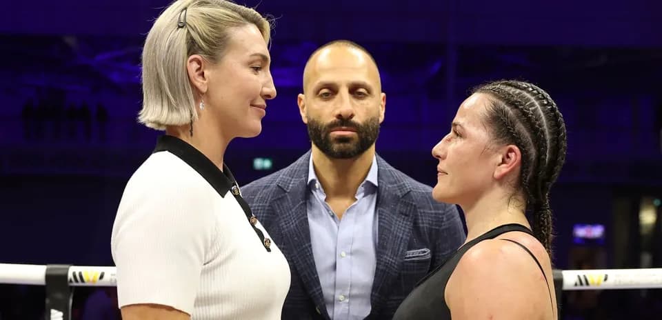Two fighters facing off before a boxing match