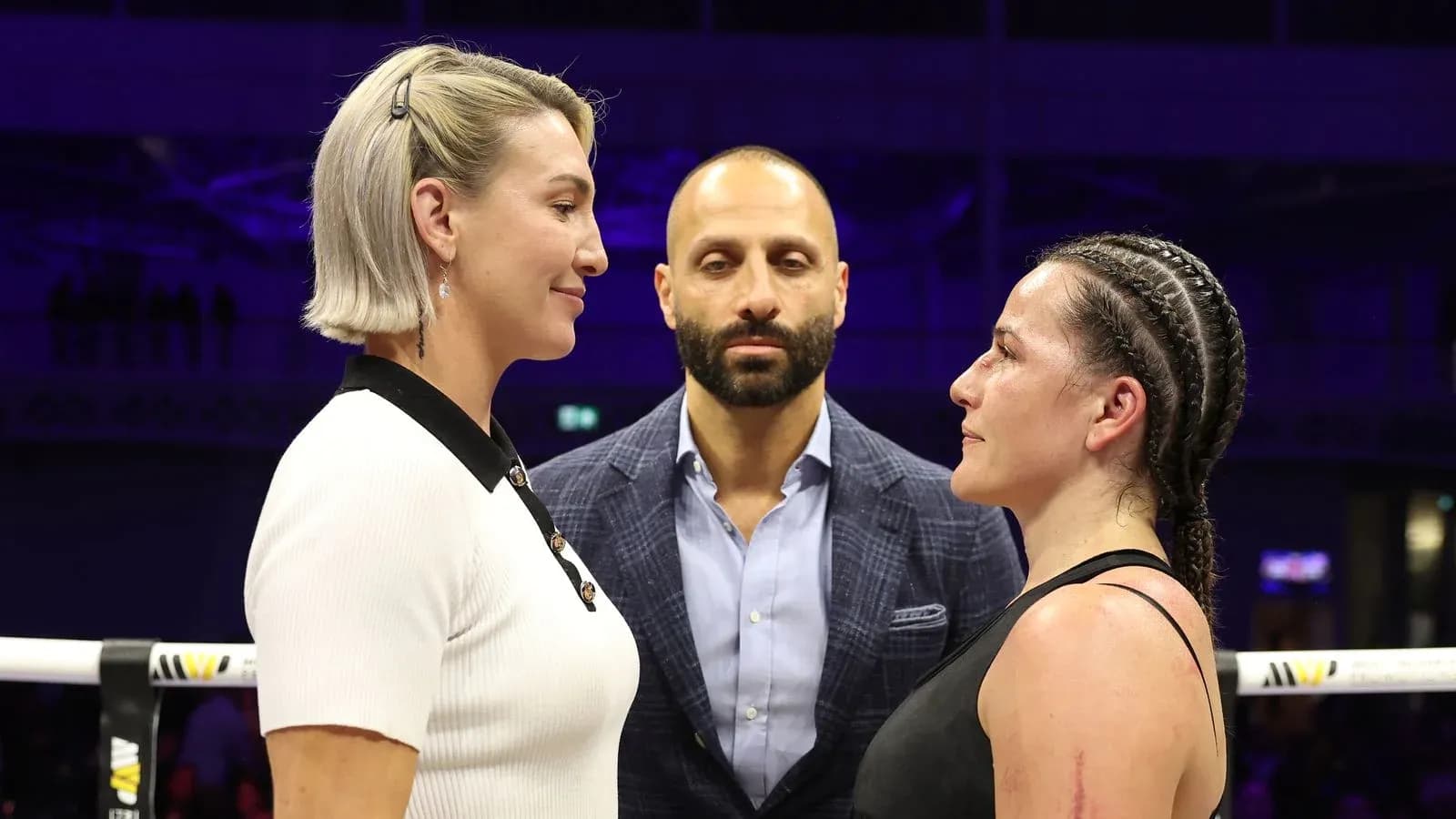 Two fighters facing off before a boxing match