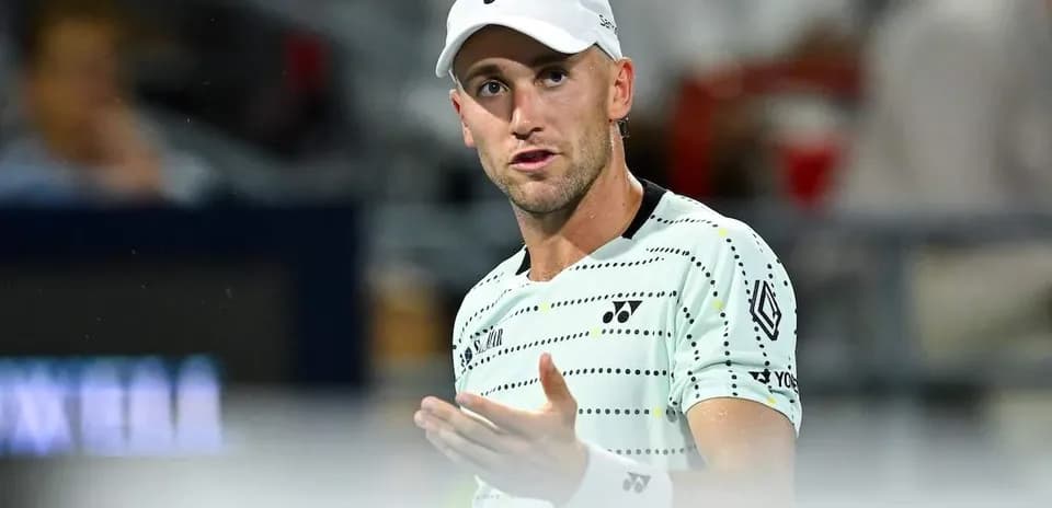 Tennis player gesturing during a match
