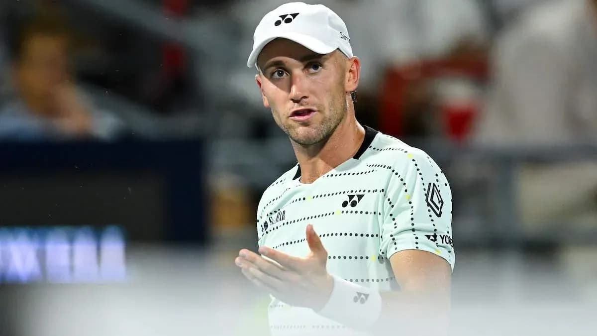 Tennis player gesturing during a match