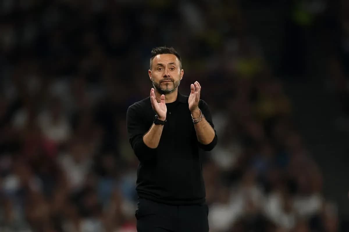 Coach applauding during a football match