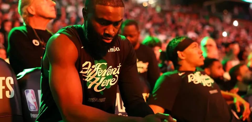 Players sitting on bench during NBA playoff game