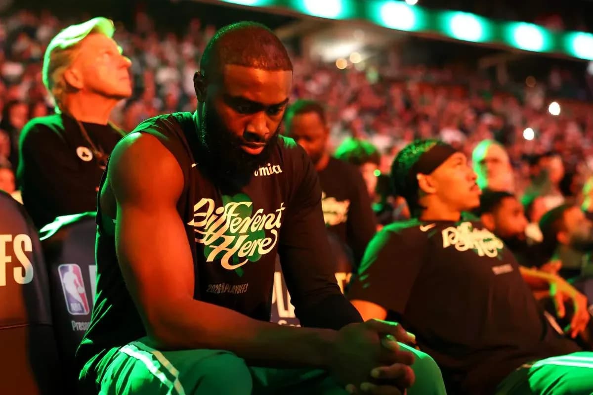 Players sitting on bench during NBA playoff game