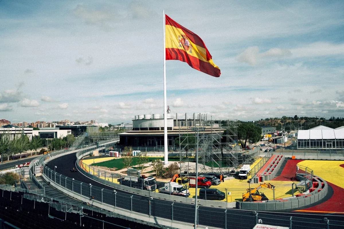 Spanish flag flying above a racetrack under construction
