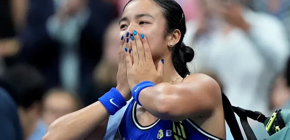 Tennis player celebrating with hands on face