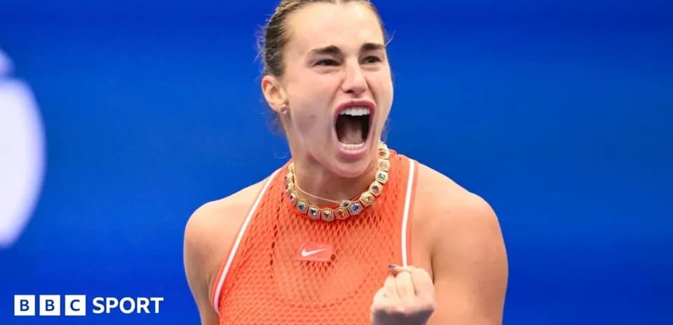 Tennis player celebrating during match with clenched fist