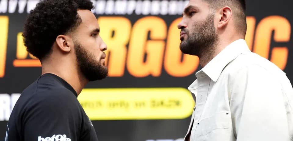 Two boxers facing off at promotional event